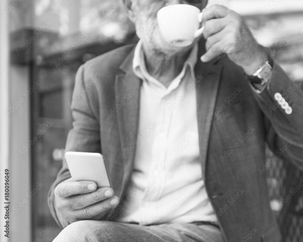 Elderly man is using mobile phone Elderly man is using mobile phone