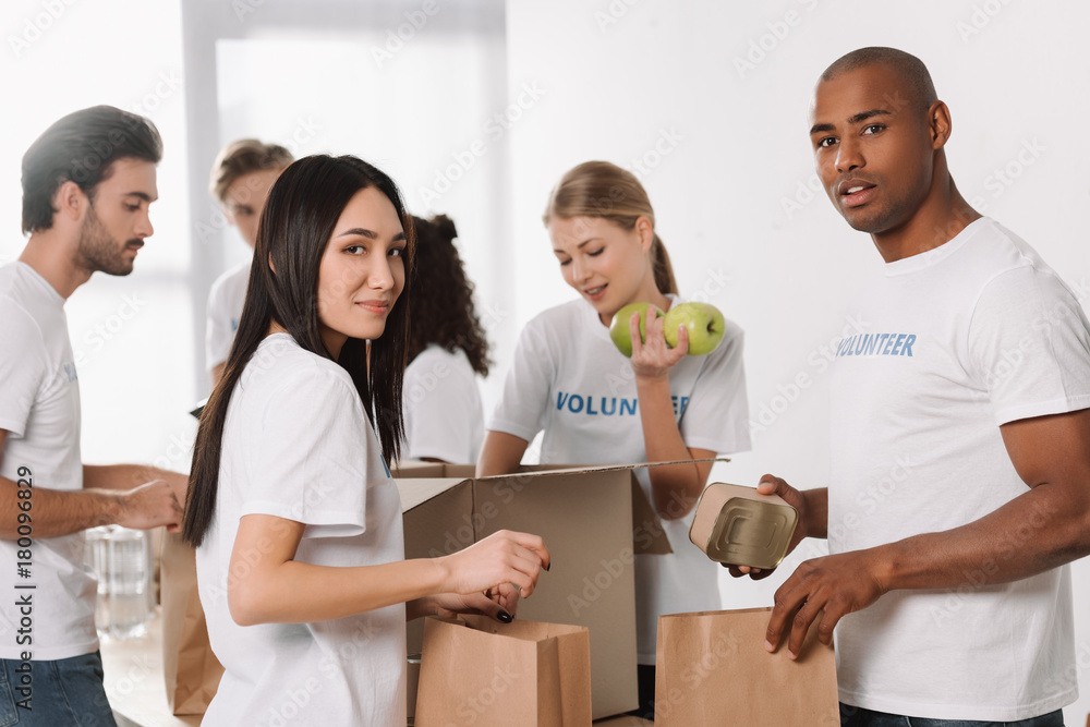 volunteers packing food for charity volunteers packing food for charity