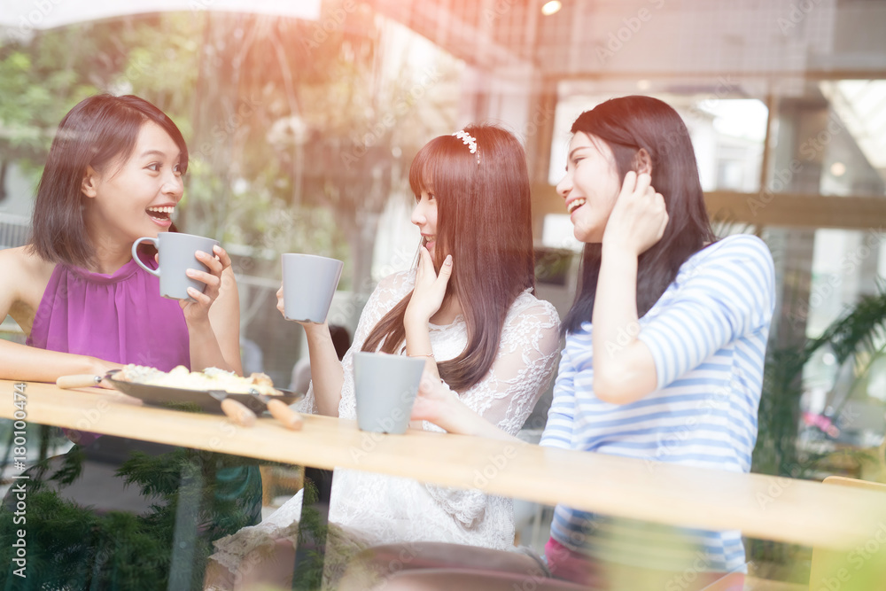 happy woman friends in restaurant