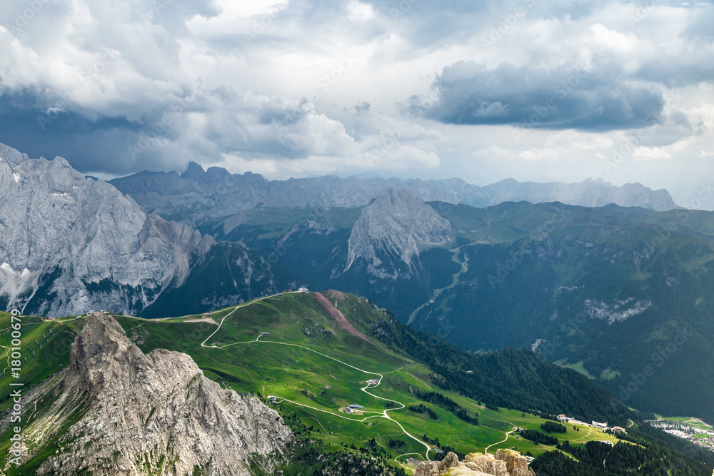 Fototapeta premium Cloudy day in Italian Dolomites Alps. Beautiful mauntain landscape. Passo Pordoi. South Tyrol. Italy
