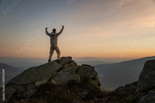 Happy male hiker on mountain top