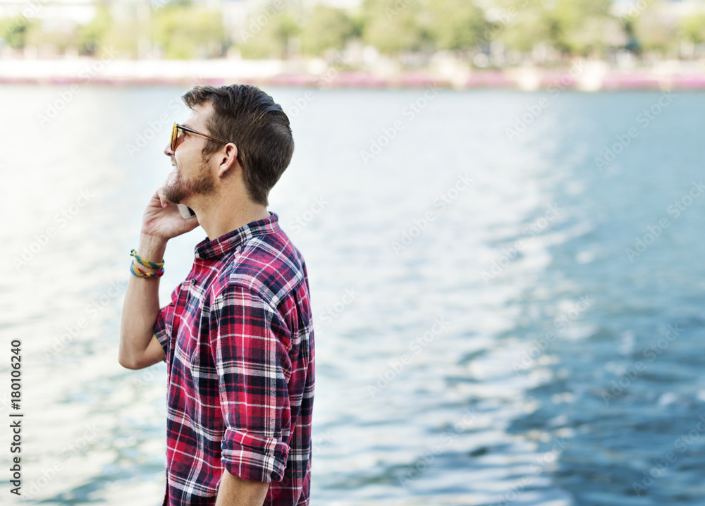 Young Man Outdoors Talking Smartphone Concept Young Man Outdoors Talking Smartphone Concept