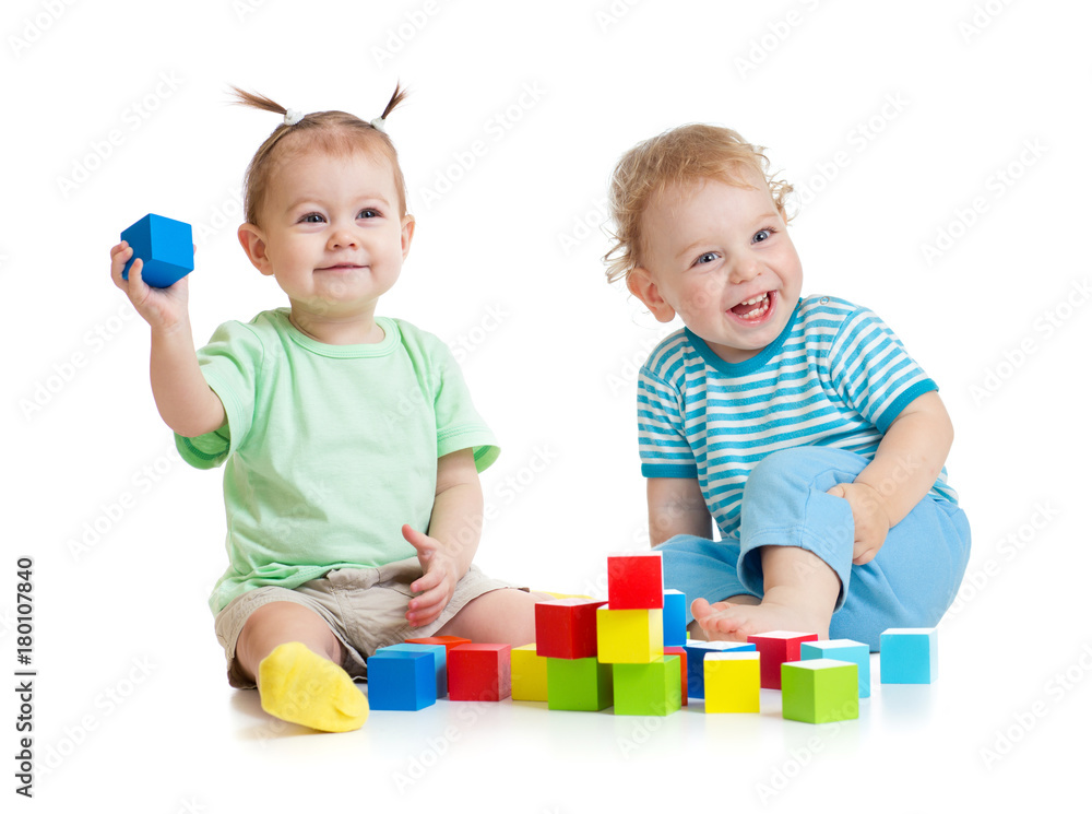 Funny kids playing colorful toys isolated on white Funny kids playing colorful toys isolated on white