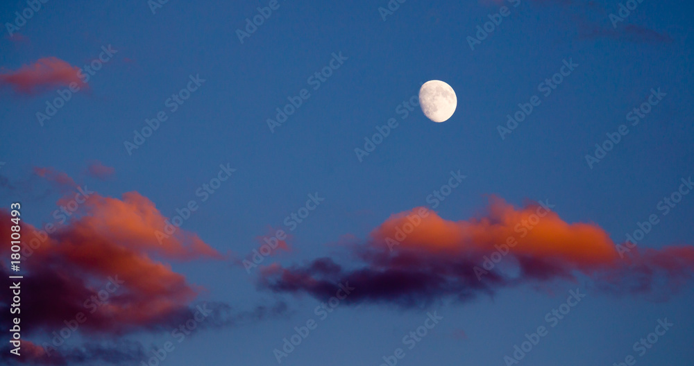Moon in the sky and a red cloud