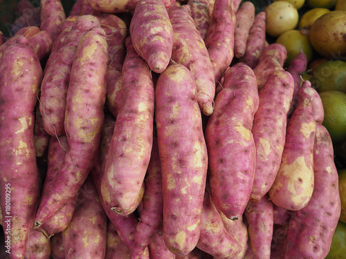 Fresh purple yams pile sale on the market.