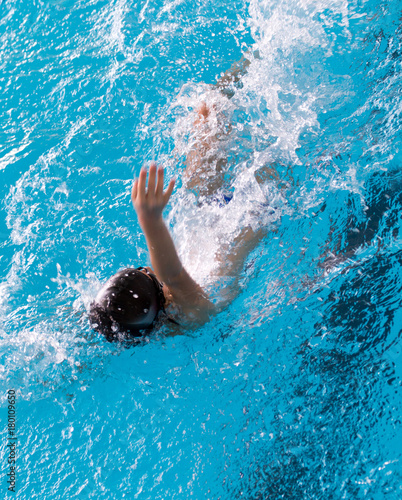 boy on a swim in a sports pool