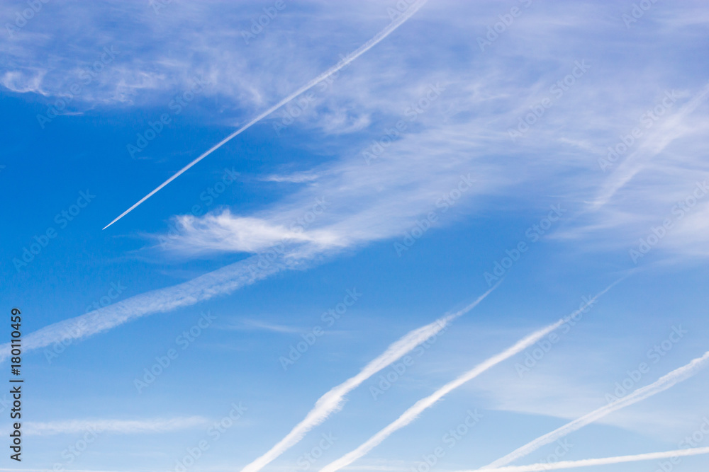 traces of an airplane on a blue sky traces of an airplane on a blue sky