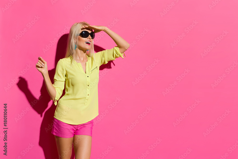 Happy Woman In Sunlight Is Looking Away