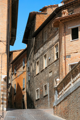 Urbino, Italy - August 9, 2017: A small street in the old town of Urbino. sunny day.