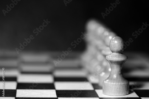 Chess figures on a chessboard. Black and white