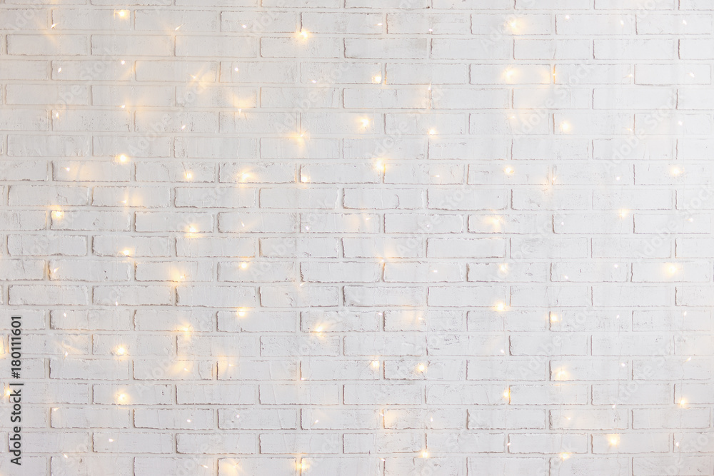 white brick wall background with shiny lights