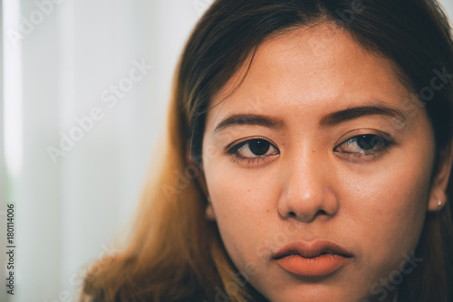 Close up sad beautiful asian woman from unrequire love,she think so much about boyfriend,life without love photo