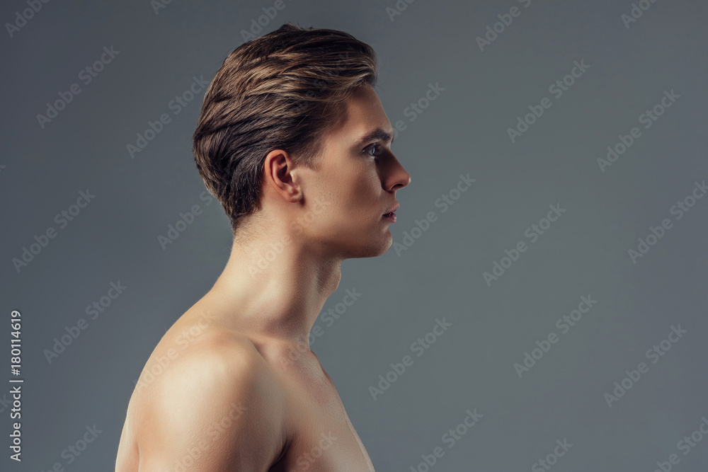 Handsome man on grey background Handsome man on grey background