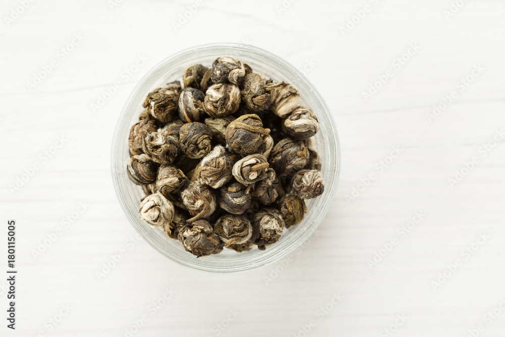 Dry tea balls in a small glass dish top view Dry tea balls in a small glass dish top view