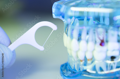 Dental floss cleaning teeth