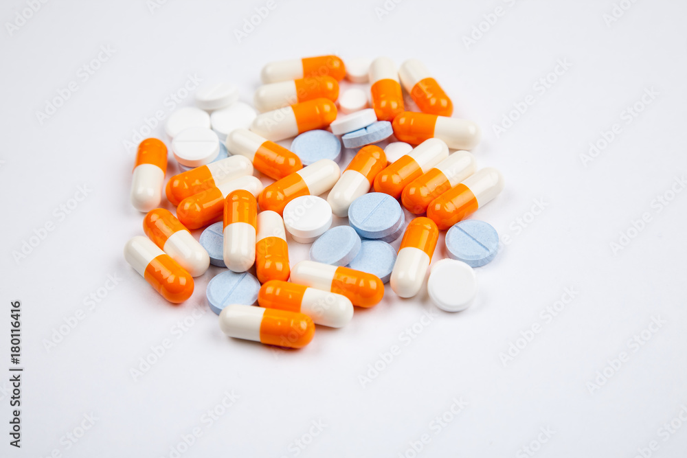 Medications and pills on a white background closeup shot Medications and pills on a white background closeup shot