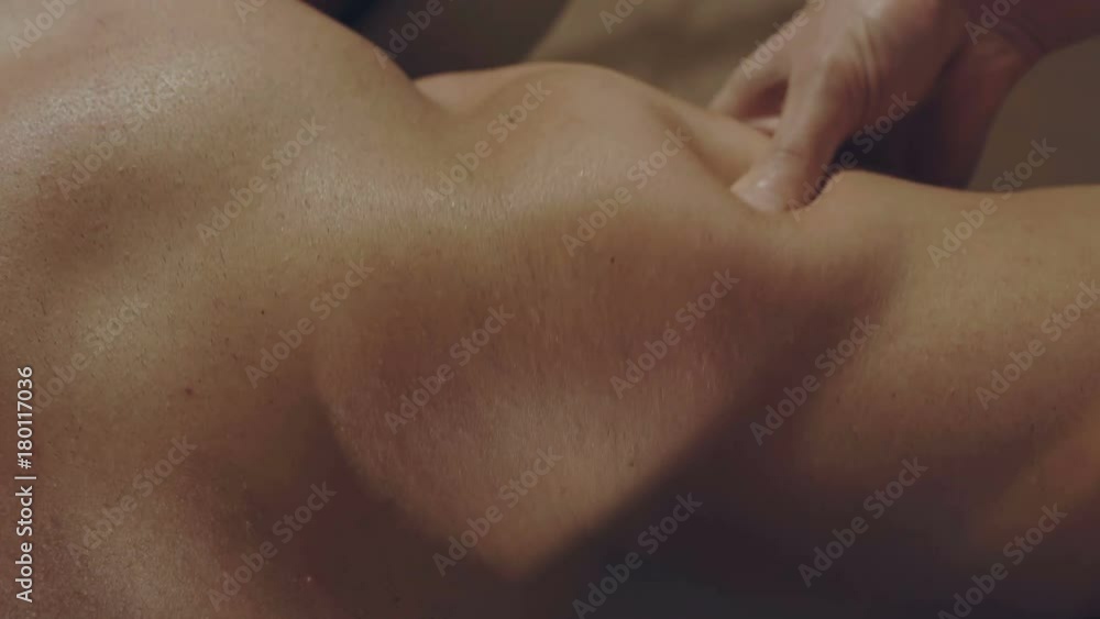 Top view of masseur makes a male back massage in spa center 4K Top view of masseur makes a male back massage in spa center 4K