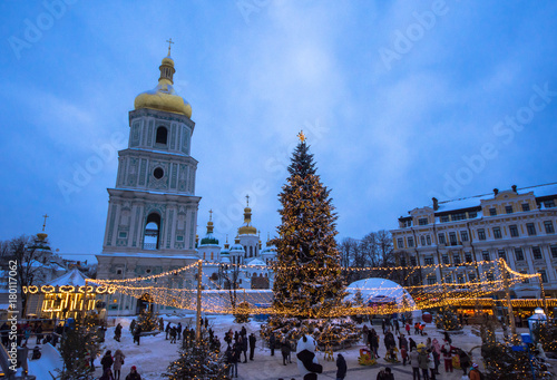 KIEV, UKRAINE - JANUARY 4, 2017: Christmas Fair is a very popular among locals due to variety of amusements for kids, such as carousels and actors dressed in different costumes, on January 4 in Kiev. photo