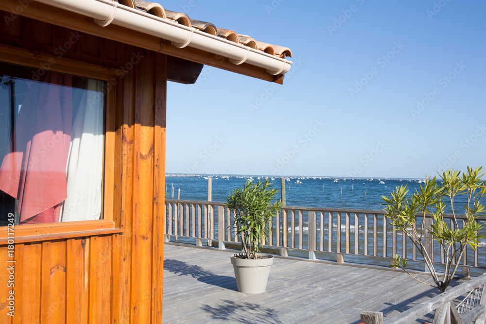 Wooden house with a terrace overlooking the sea