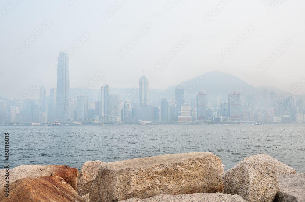 Fototapeta premium The skyscrapers of Hong Kong's financial district and Victoria Peak obscured by air pollution