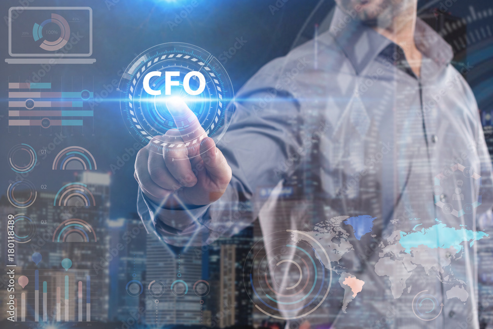 Business, Technology, Internet and network concept. Young businessman working on a virtual screen of the future and sees the inscription: CFO Business, Technology, Internet and network concept. Young businessman working on a virtual screen of the future and sees the inscription: CFO