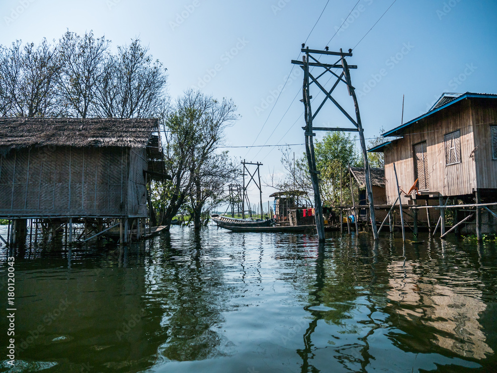 The village on wooden piles of Intha people living over water at Inle lake, Shan state, Myanmar The village on wooden piles of Intha people living over water at Inle lake, Shan state, Myanmar