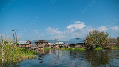 The village on wooden piles of Intha people living over water at Inle lake, Shan state, Myanmar © Mongkolchon