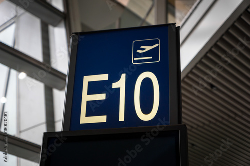 Airport Boarding gate entrance number sign board in departure area