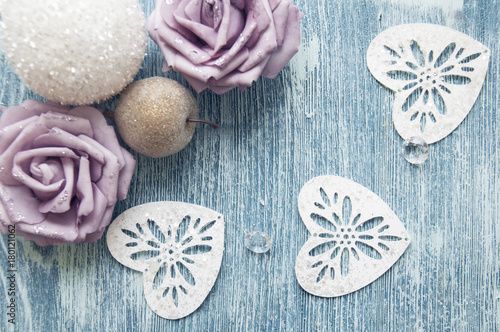 Christmas winter roses on wooden blue background on a happy sunny day