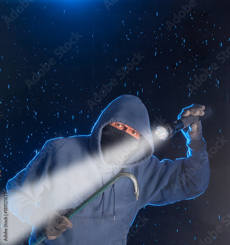 Canvas Print Intruder prowling in the night for a house break in.