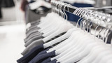 Women's tops on hangers in a clothing store close-up