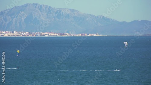 Kitesurfers surfing in the coast of spain near to africa