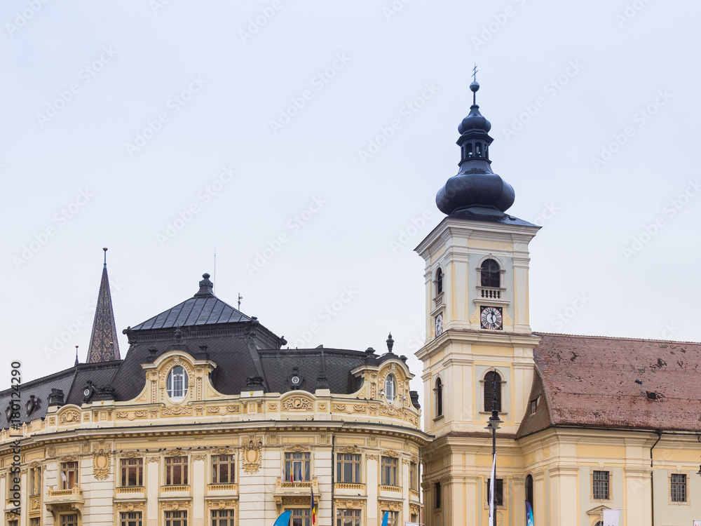 Fragment  of the Roman Catholic Church of the Holy Trinity and Sibiu City Hall on the Large Square in Sibiu city in Romania