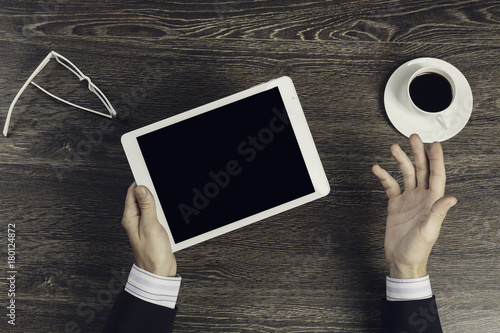 Tablet pc with blank screen in hands