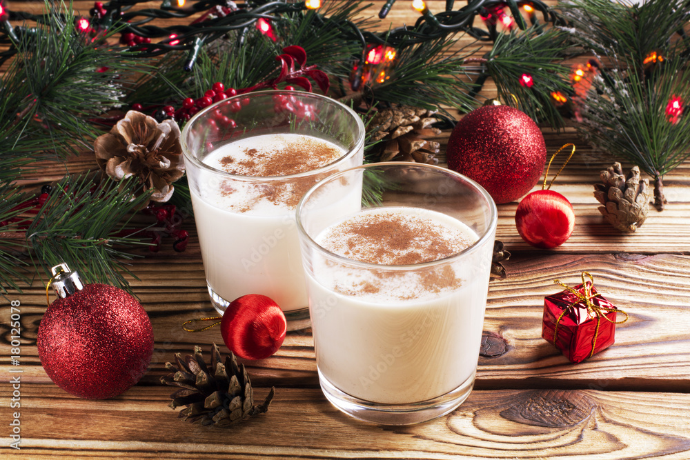 Glass of eggnog on wooden background Glass of eggnog on wooden background