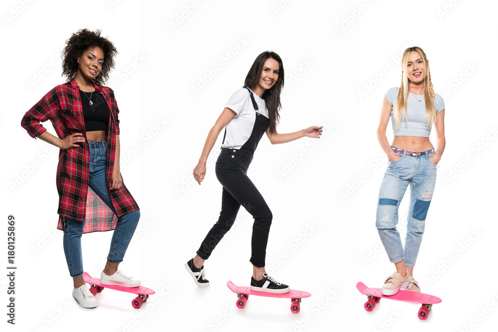 Fototapeta premium multicultural women on pennyboards