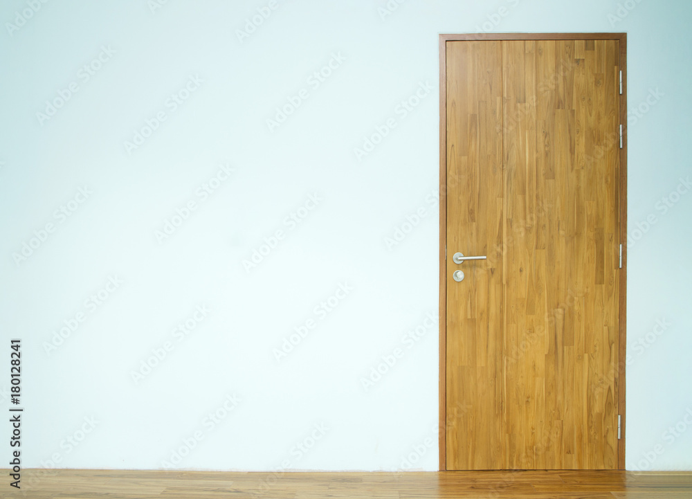 Wooden door with blue wall Stock Photo | Adobe Stock
