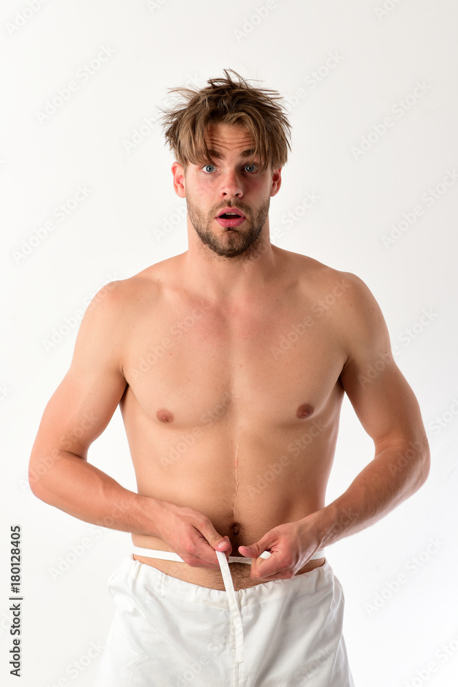 Athlete with fit strong body measures waist Athlete with fit strong body measures waist