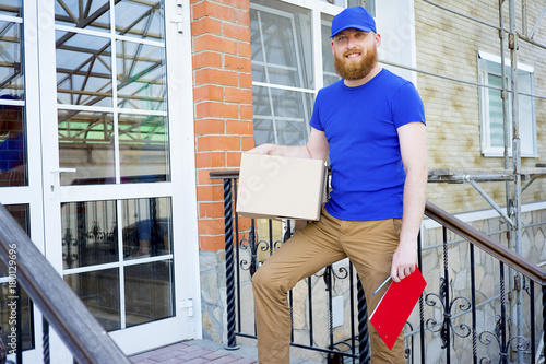 Delivery man delivering boxes photo