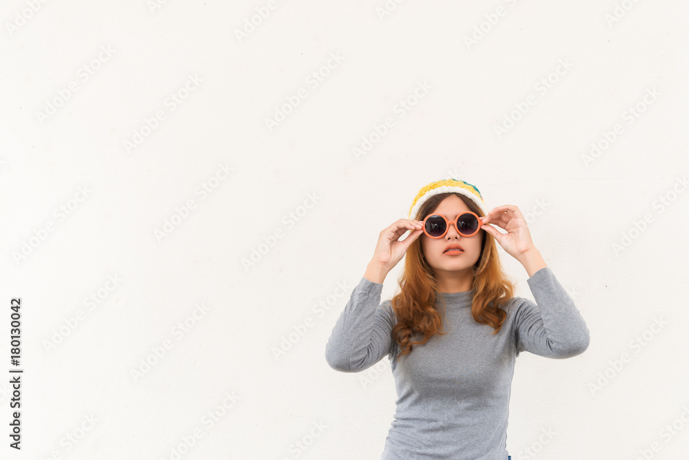 Portrait of hipster girl on white wall,lifestyle of modern teen,Cool hipster student woman wearing eyewear glasses Portrait of hipster girl on white wall,lifestyle of modern teen,Cool hipster student woman wearing eyewear glasses