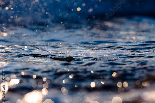 foaming seawater with pebbles