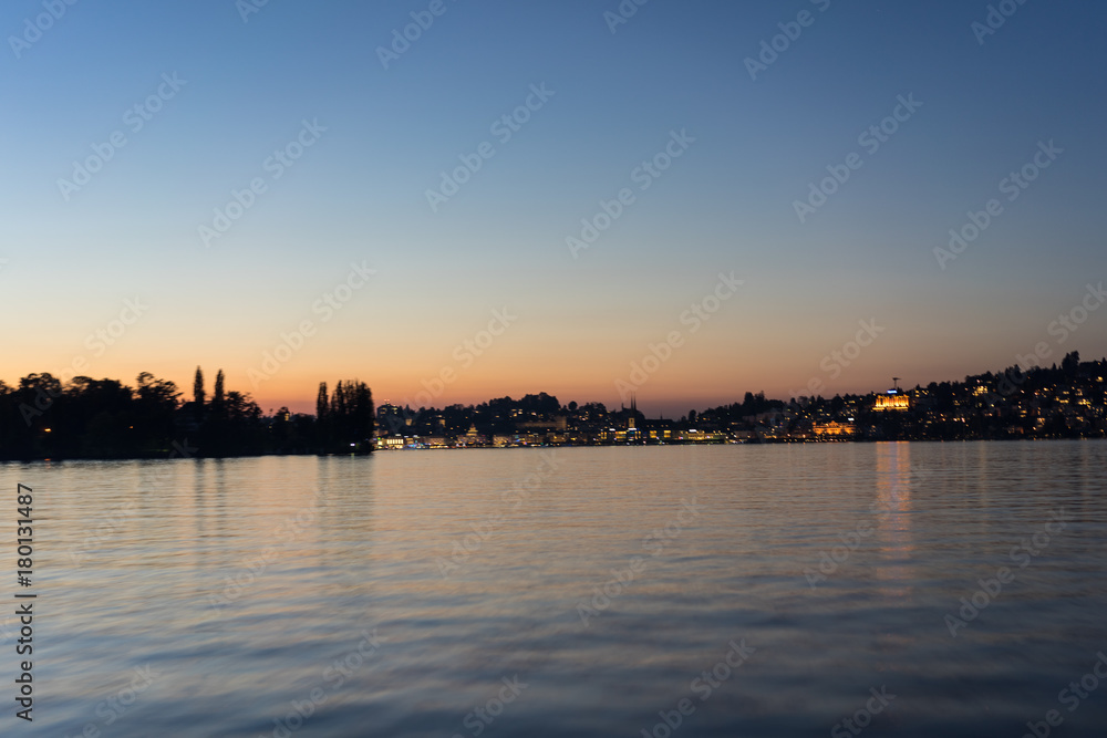 sunset over lake lucerne with water and red sky