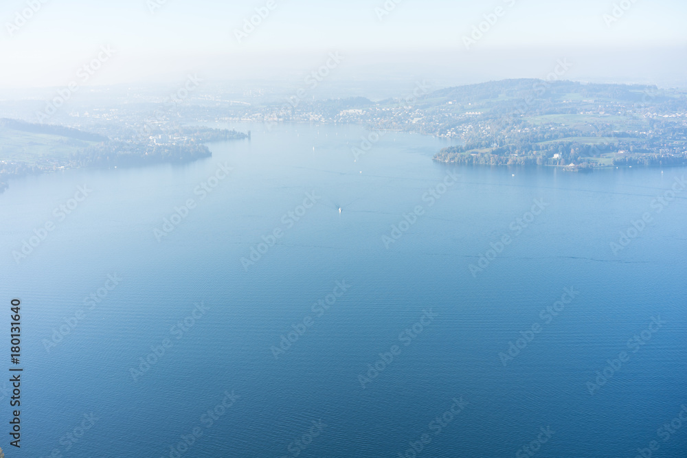 Fototapeta premium view of lake lucerne from buergenstock with fog