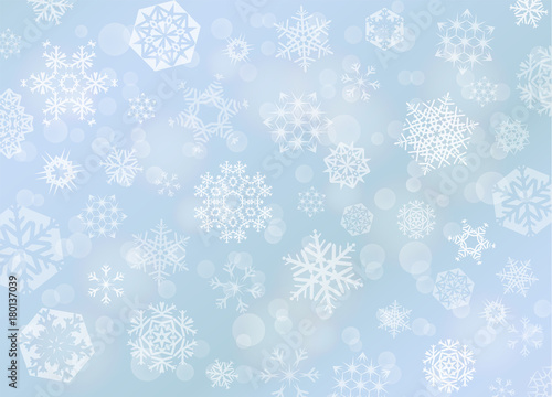 Light blue Christmas background with white snowflakes