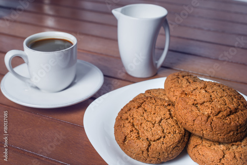 A cup of coffee and cookies