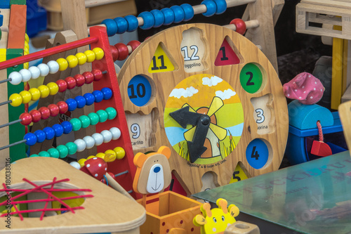 Market stall with objects and children toys sold at the weekend flea market in the city center.