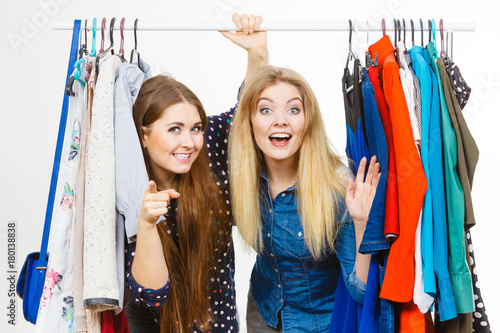 Happy women clothes shopping