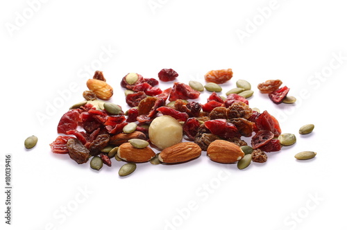 Mix of roasted and salted macadamia, almonds, pumpkin seeds and raisins isolated on white background
