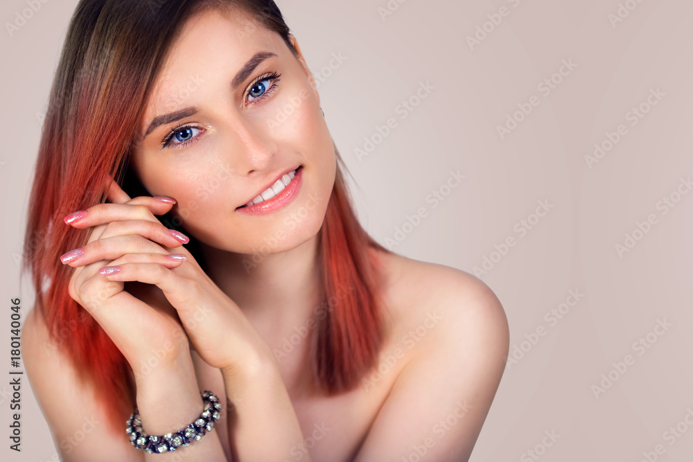 Portrait of a beautiful young smiling woman with tinted red hair Portrait of a beautiful young smiling woman with tinted red hair