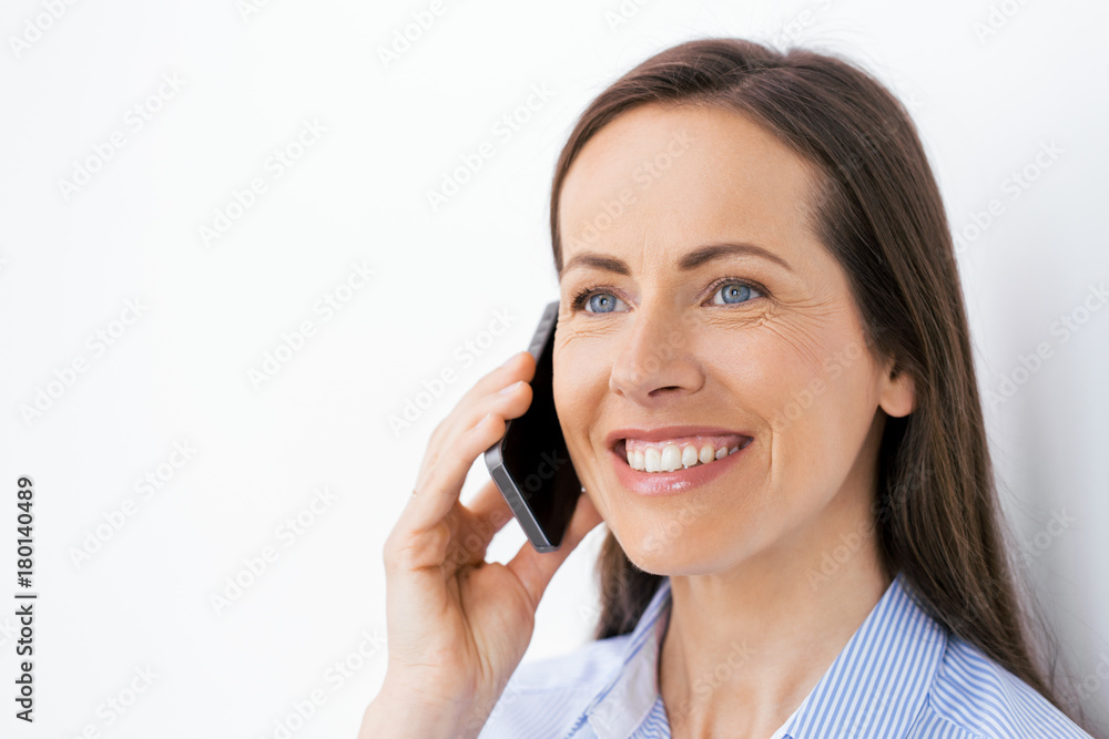 businesswoman calling on smartphone at office businesswoman calling on smartphone at office